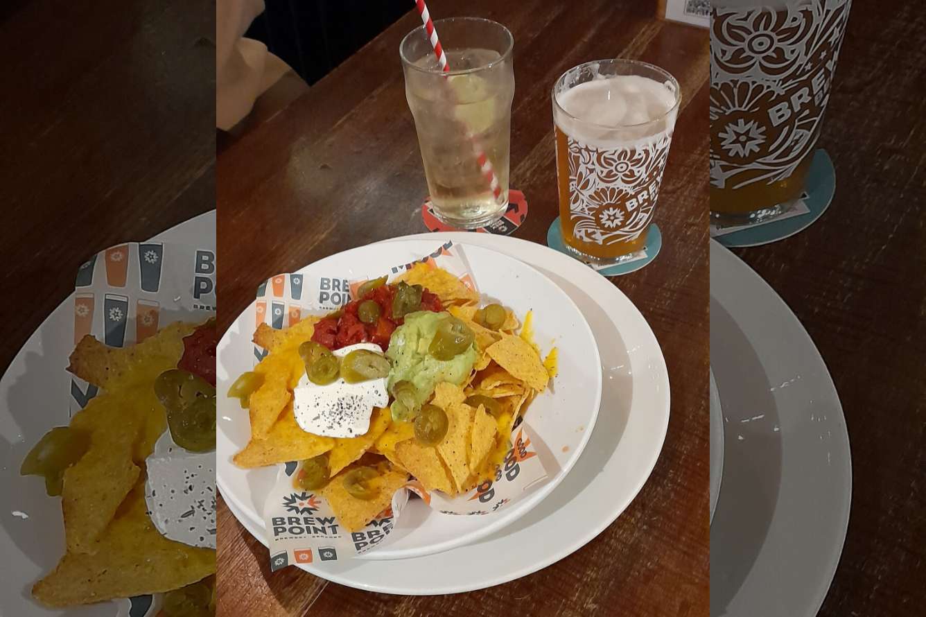 Photo of nachos and drinks